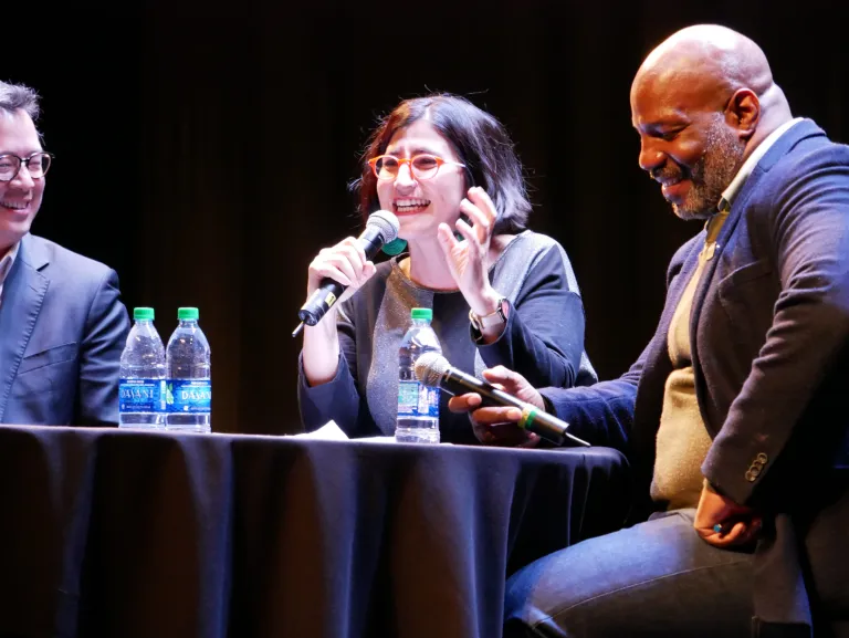 3 People at a table druing a conference